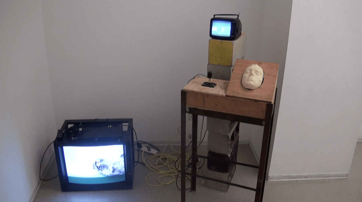 'Gimp,' an interactive video game by Nevada Hardman. A surreal digital experience created using Processing. Users punch Artists face.
