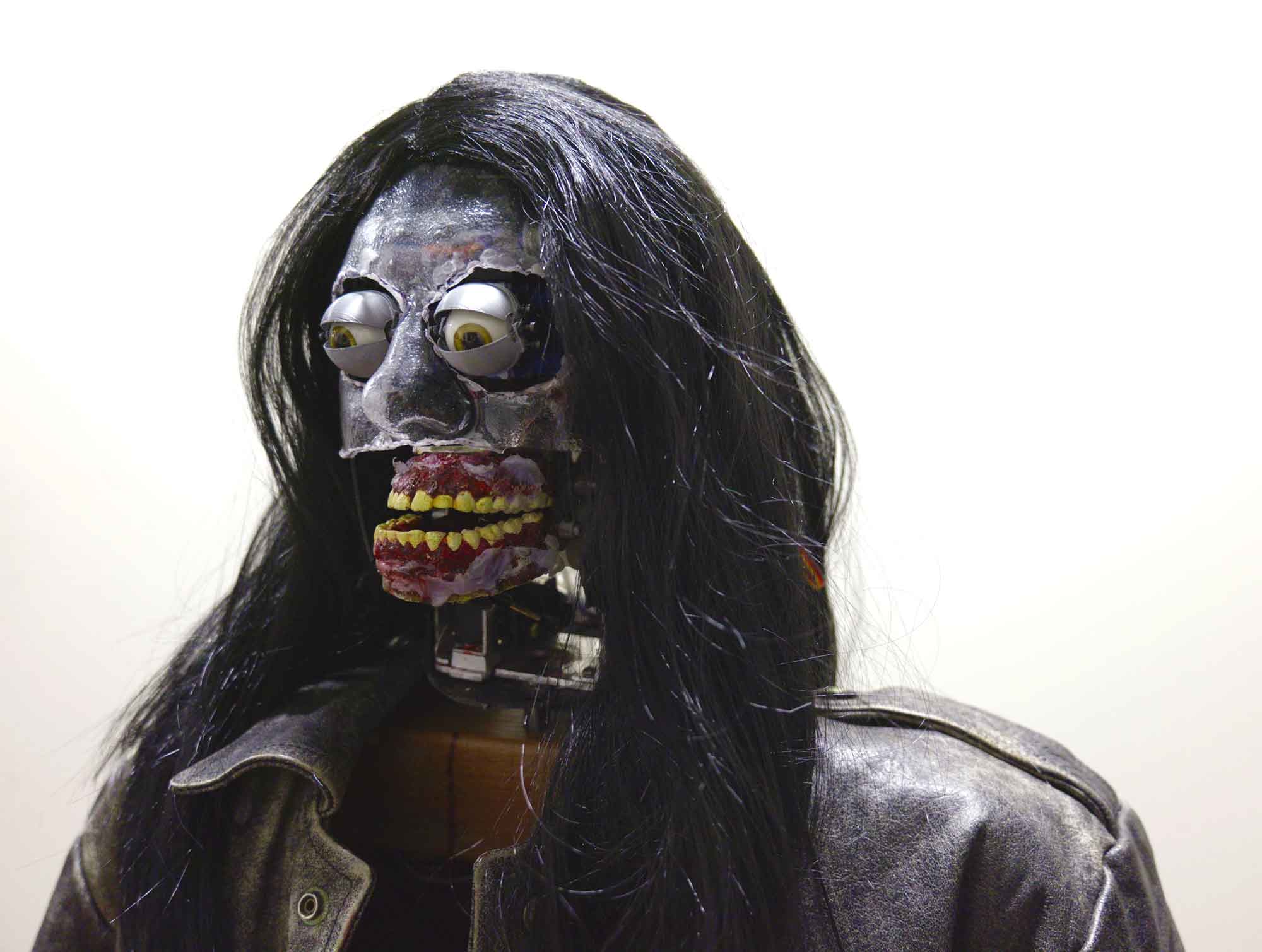 Kinetic sculpture 'Puker' by Nevada Hardman. Made of plastic, aluminum, and electronics, featuring robotics vomiting blood. 2024